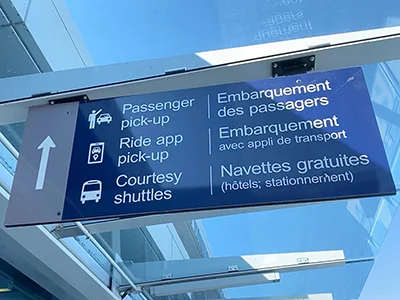 Photo of the sign at the airport directing people where to go for pick-up